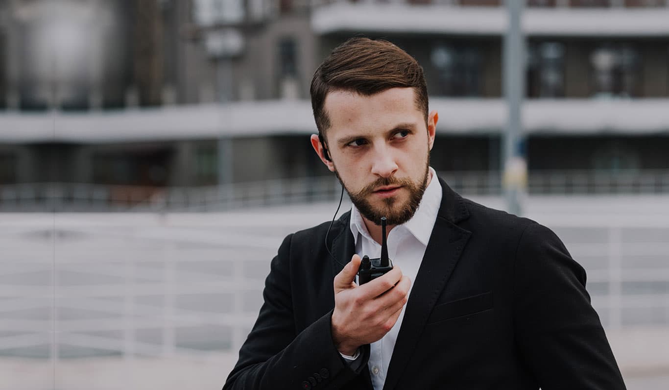 Eureka Security guard communicating with dispatch during an alarm response